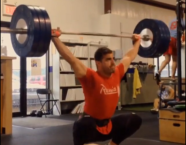Author Wil Fleming hitting a 140 kg snatch. (308 lbs)