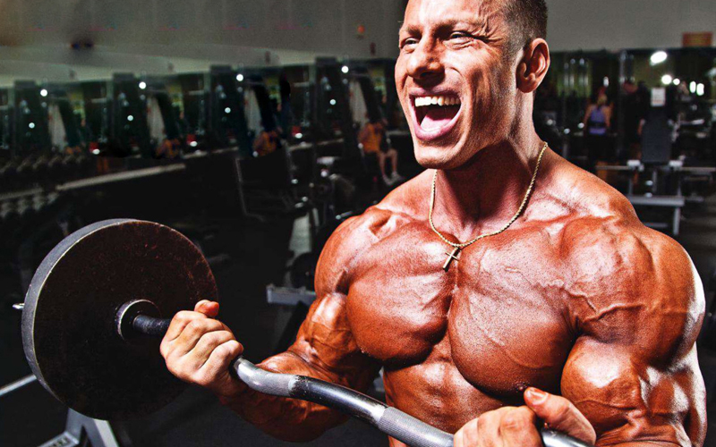 Bodybuilder Blows Arms Out With Oil Injections