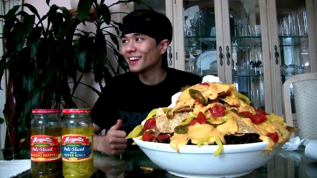 matt stonie with a big bowl of nachos