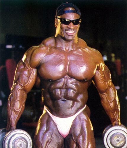 ronnie coleman holding a dumbbell in each hand