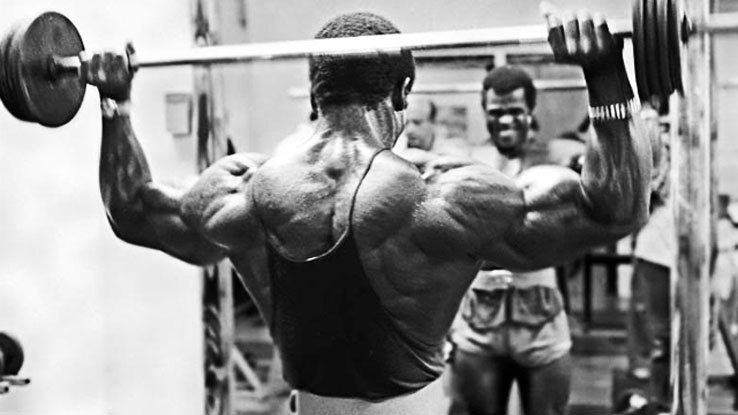 serge nubret performing shoulder presses