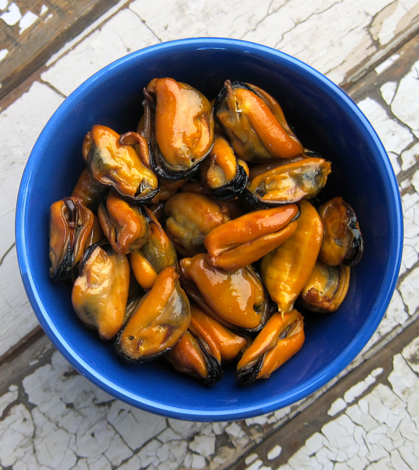 a bowl of smoked mussels