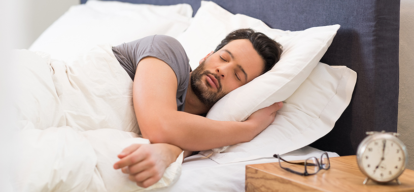 a man sleeping peacefully in his bed