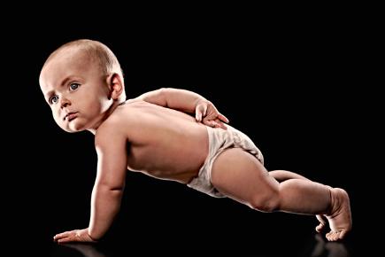 a baby doing one arm pushups