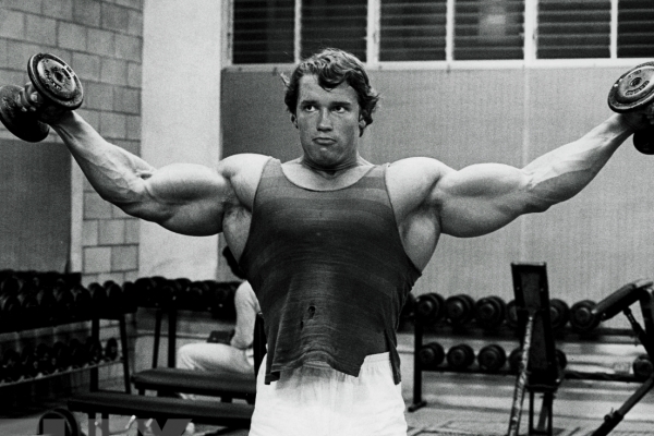 Arnold Schwarzenegger Shoulder Workout lateral raise black and white 
