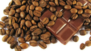 Coffee beans and cocoa on white background