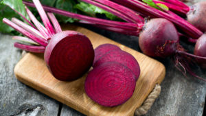 Red beetroot chopped on a wooden board