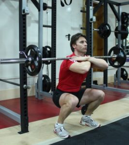Cross-arm front squat in the gym