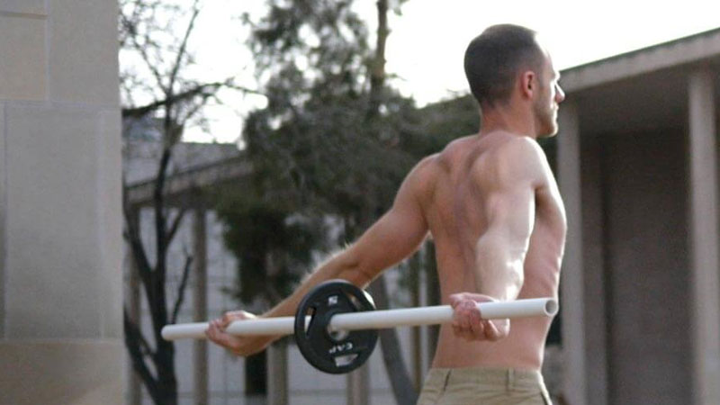 Shoulder mobility exercise using a bar dowel