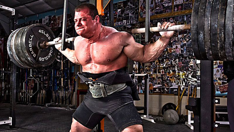 Heavyweight athlete strength training with heavy back squat