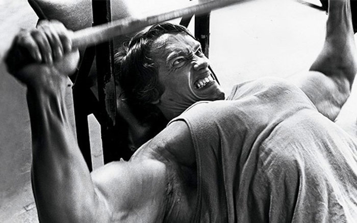 arnold angrily bench pressing