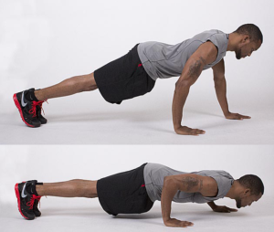 man performs staggered push up variation