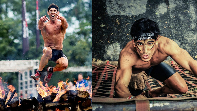 Two men tackling obstacles in obstacle course race