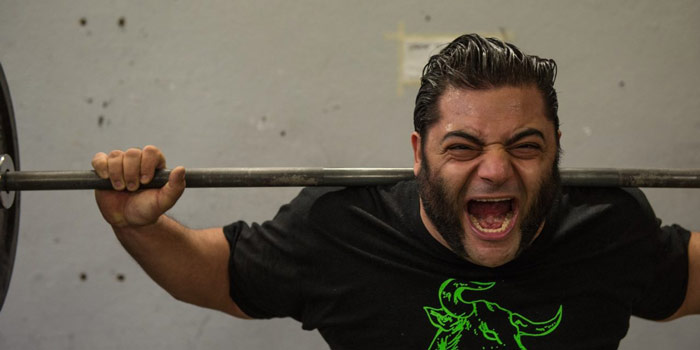 Patrik Baboumian lifting heavy squat
