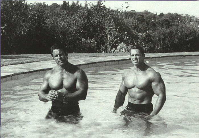 arnold schwarzenegger and reg arnold in swimming pool