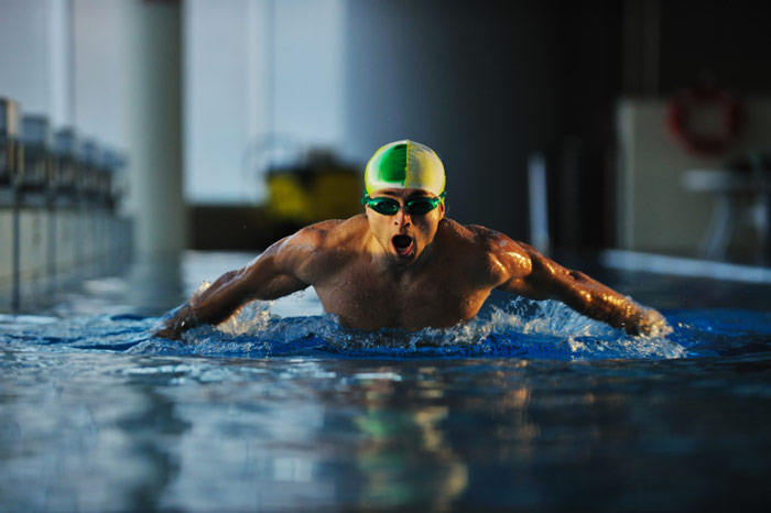 bodybuilder butterfly stroke swimming for gains