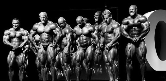 bodybuilders on stage showing minimal bodyfat due to necessary cardio training for cutting