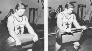 Legendary larry scott showing pronated wrist curl variation on bench