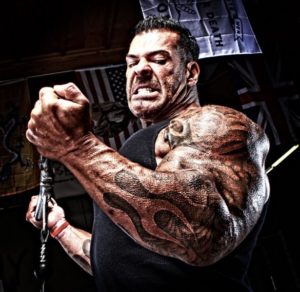 the late bodybuilder Rich Piana showing his incredibly muscular arms