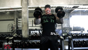 rich piana performig hammer curls as part of arms workout