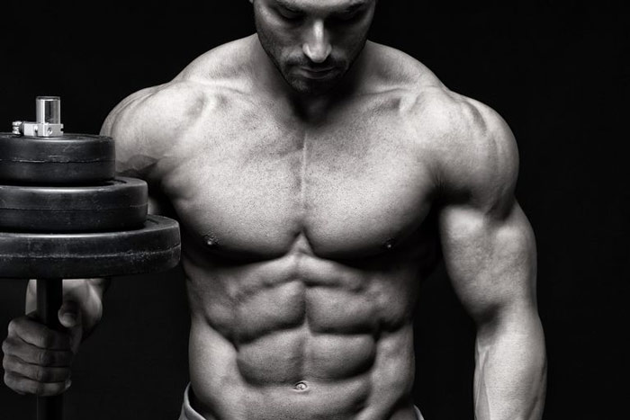 ripped athlete showing you can replace fat with muscle through hard work and diet