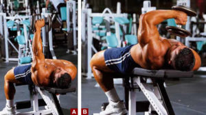 single arm lying dumbbell tricep curl demonstration by bodybuilder