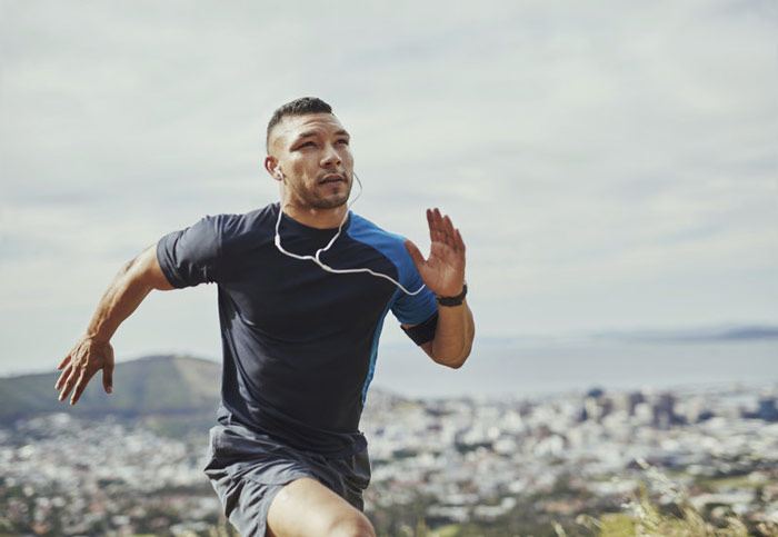 a runner showing a high level of fitness and concentration