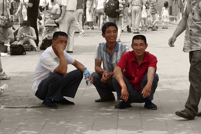three men doing third world squat as a resting position