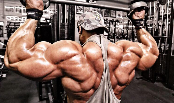 bodybuilder fixing imbalance of size with volume training