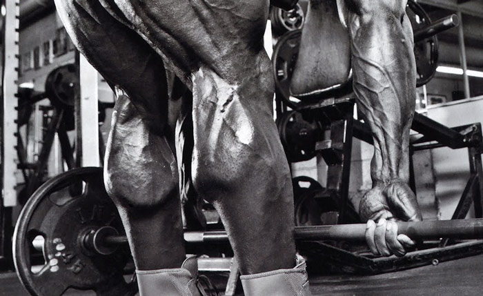 black and white image showing Kai Greene's calf muscles