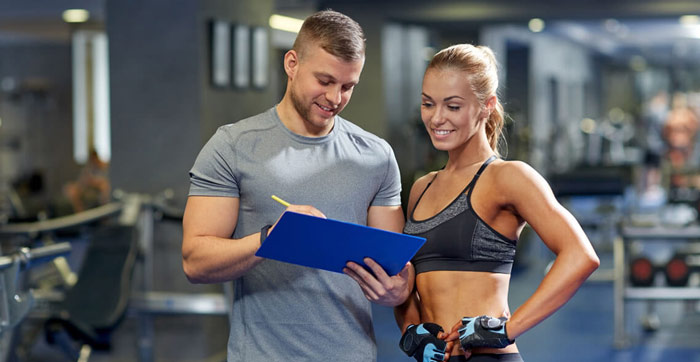 A personal trainer talking client through goals