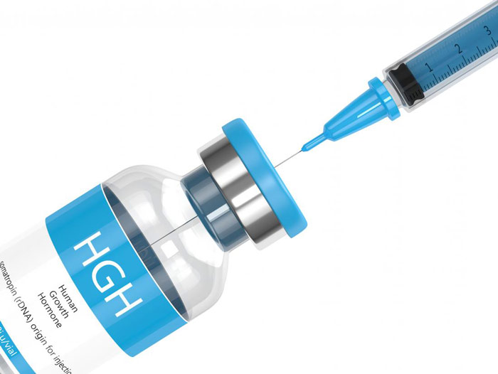 vial of human growth hormone with syringe inside