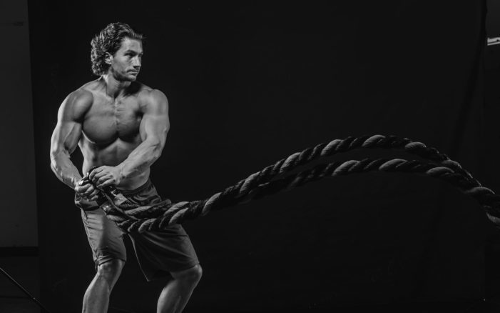 benefits of battle ropes shown in athletic body of an athlete