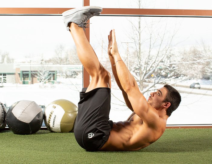 guy performing jack knife sit ups