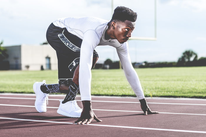 skinny guy ready to sprint