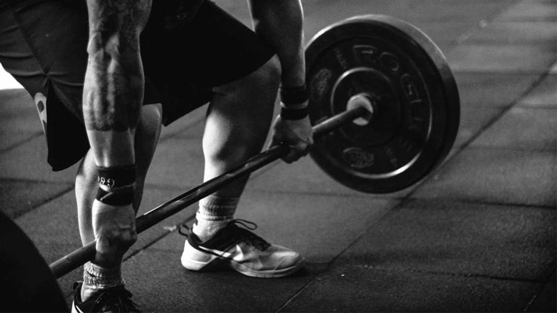 athlete using barbell complex workout to improve conditioning