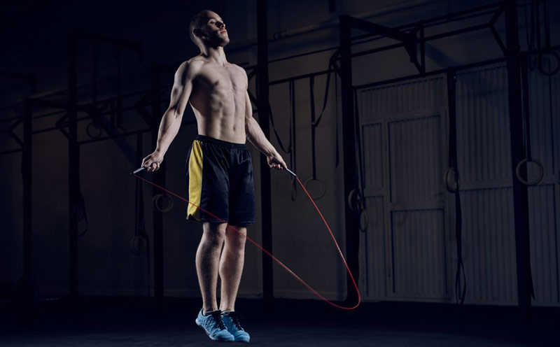athlete jumping rope for fat burning exercise