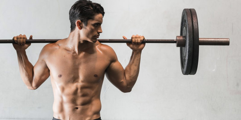 athlete using barbell complex workouts for conditioning