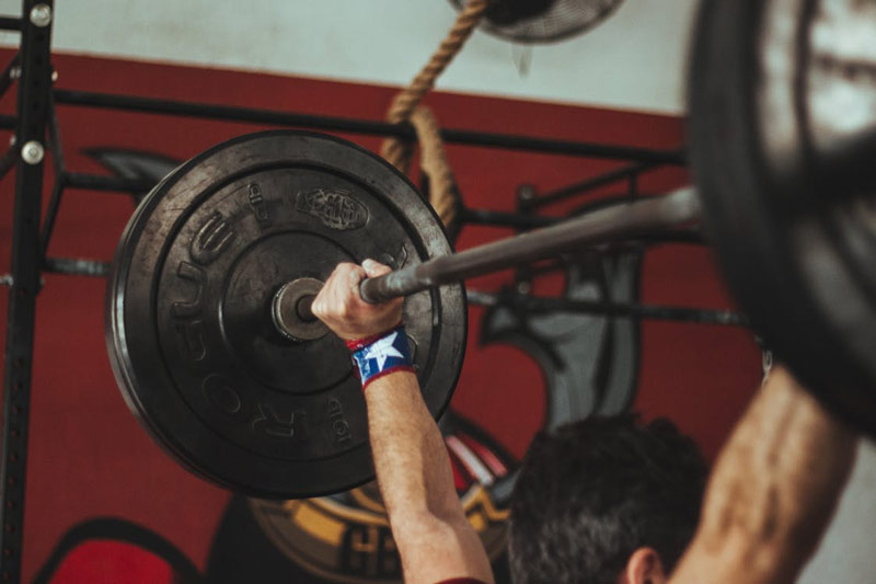 barbell snatch pressed overhead as compound exercise