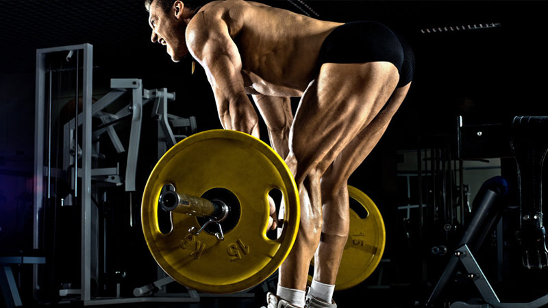 bodybuilder performing romanian deadlift for bigger hamstrings and glutes