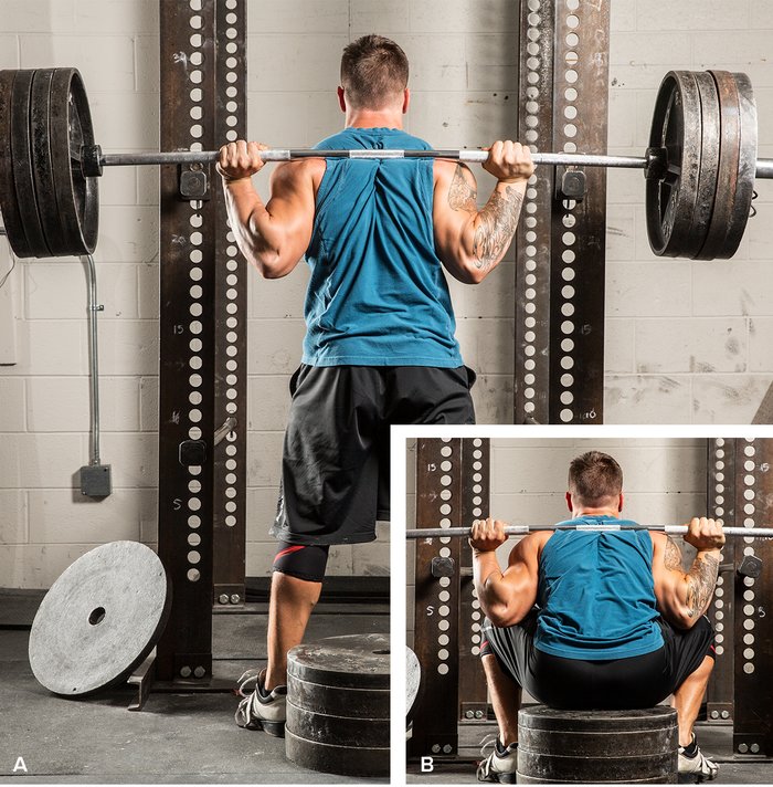 bodybuilder performing box squat technique