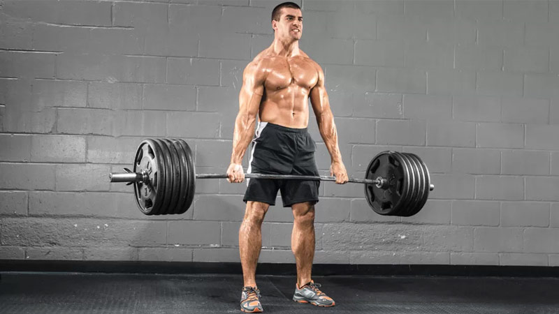 athlete performing deadlift for fat loss benefits