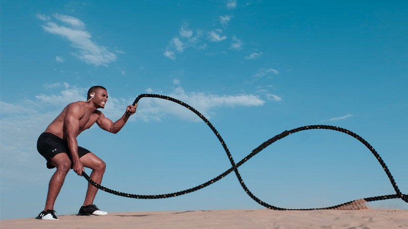 battle ropes for fat loss benefits performed by athlete