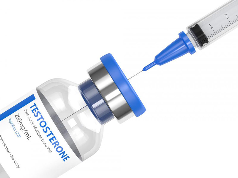 Vial of synthetic testosterone and injecting syringe