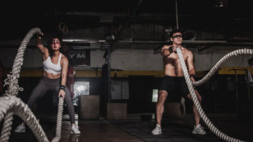 Two athletes performing lunchtime HIIT workout
