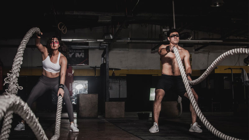 Two athletes performing lunchtime HIIT workout