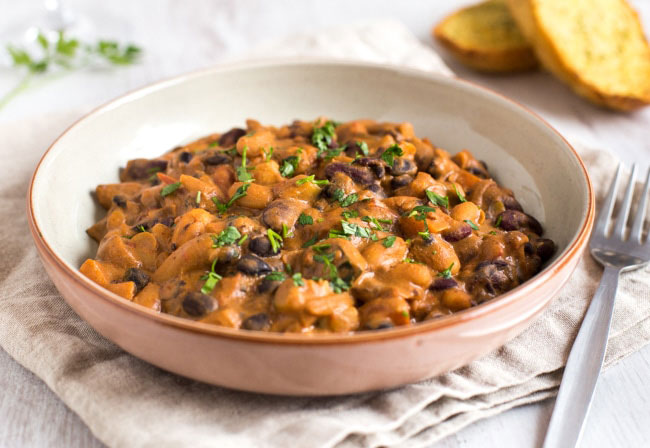 creamy three bean stew photographed in a bowl