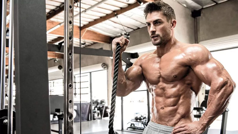athlete with ab muscles using 7 secrets for a shredded six pack core