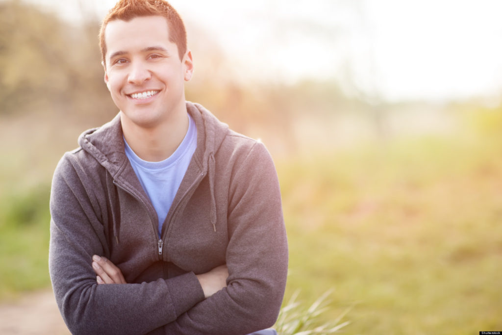 happy healthy man showing signs of healthy testosterone