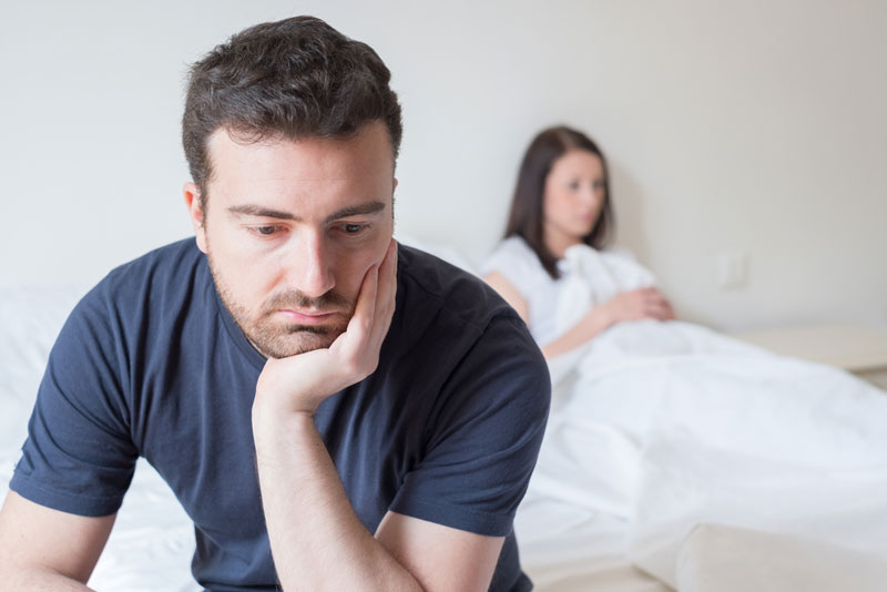 Man looking depressed showing signs of low testosterone